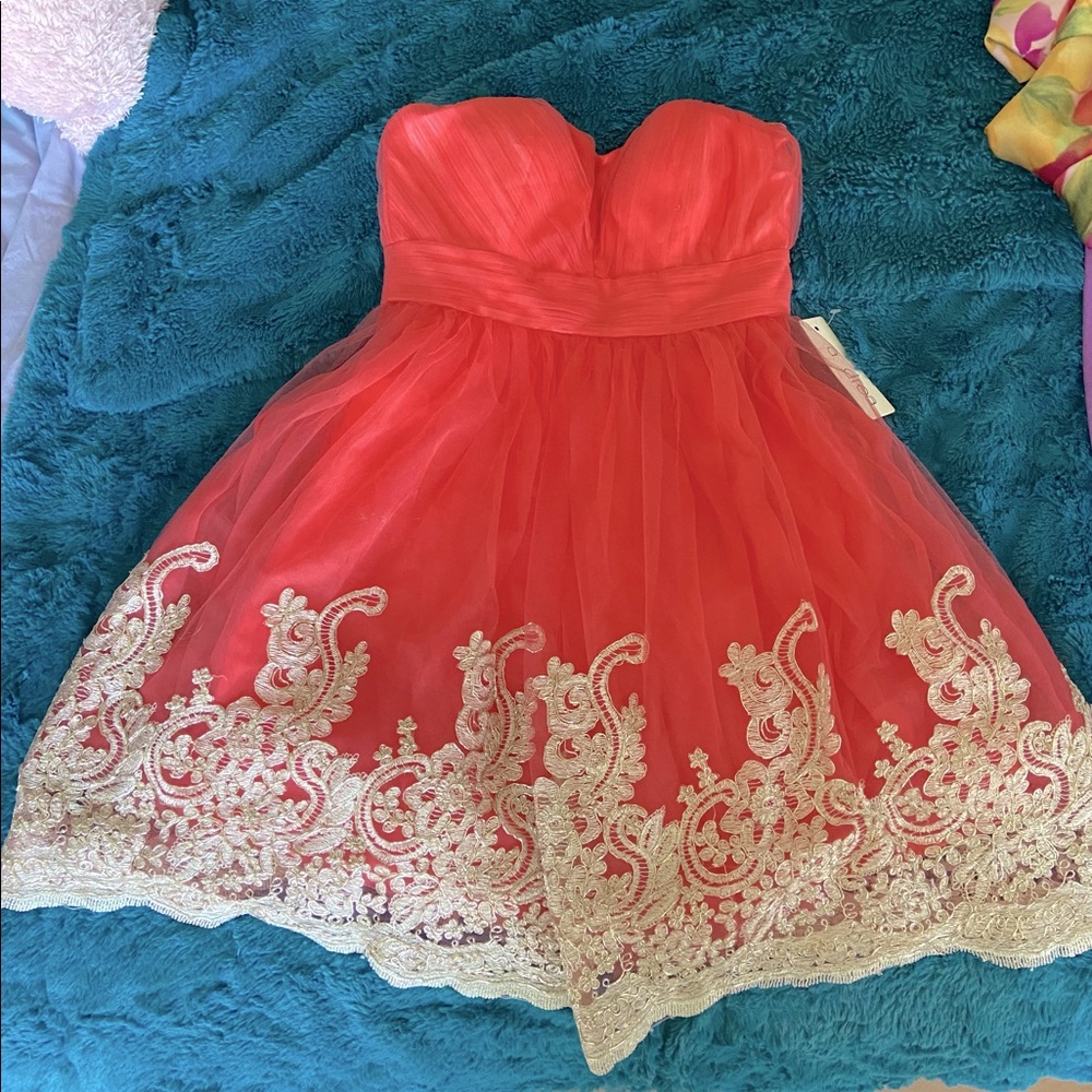 Beautiful new w/tag special occasion strapless dress. Dark peach color gold lace